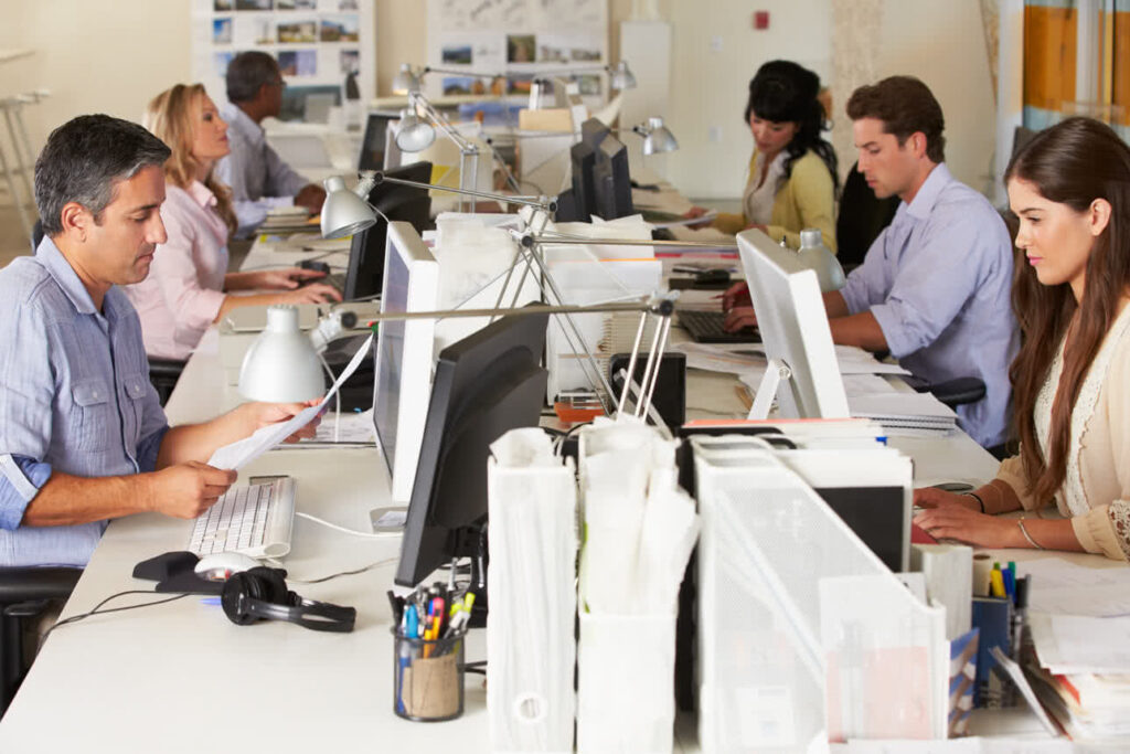 Spry Wireless: Team of office employees working at their desks.